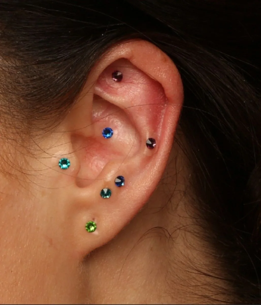 Crystal ear seeds placed on acupressure points of the ear